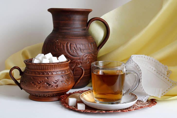 Cup of tea and sweets on the table