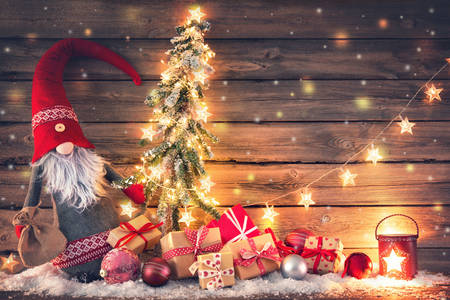 Papá Noel rodeado de regalos