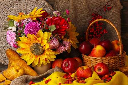 Apples and flowers on the table