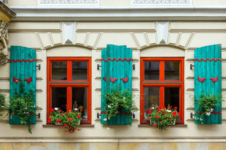 An old building with shutters on the windows